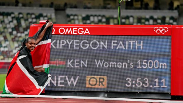 Faith Kipyegon clocks an Olympic record to win the women's 1,500 meters.